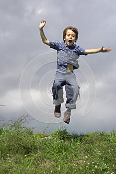 Young Boy Jumping And Shouting