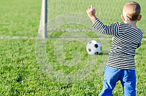 Young boy kicking a soccer ball