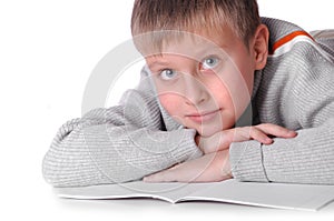 Young boy laying on the floor i