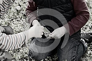 Young boy lighting a fire outdoors