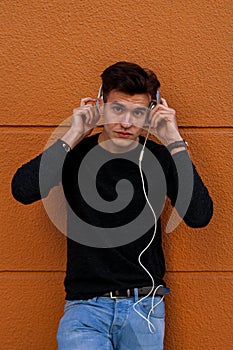 Young boy listening to music with headphones