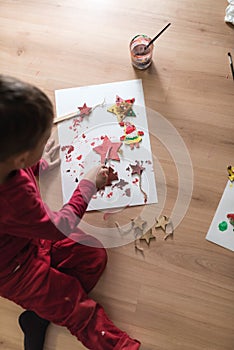 Young boy making decorations