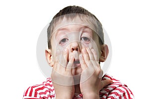 Young boy making faces photo