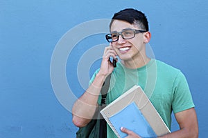 Young boy making fun plans on the phone with space for copy