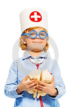 Young boy with medical cap and cerebrum dummy photo