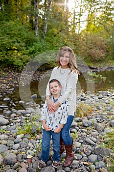 Young Boy with Mother at River in Oregon