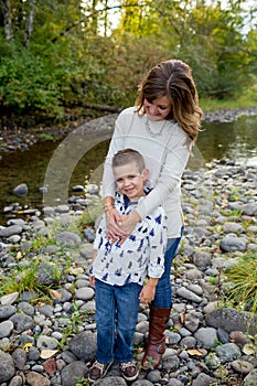 Young Boy with Mother at River in Oregon