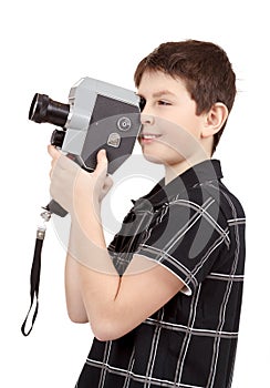 Young boy with old vintage analog 8mm camera