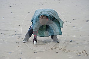 Young Boy on Oregon Beach on a Wet Day