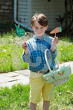 Young Boy Outside Dressed Up for Easter holding Basket