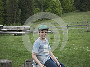 Young boy outside in the mountains