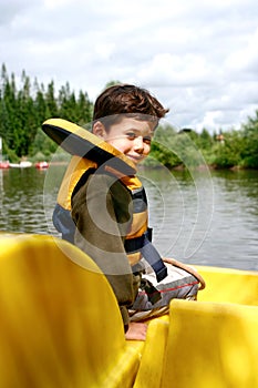 Young boy in pedalo