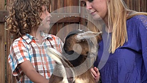 Young Boy Petting Goat