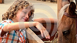 Young Boy Petting Horse