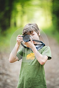 Young boy photographer with camera