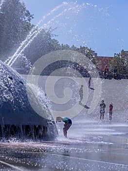 Preteen Boy at Play in Seattle Fountain