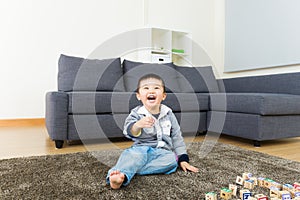 Young boy play with wooden toy block
