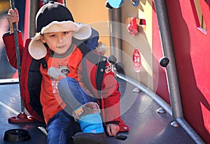 YOUNG BOY IN PLAYGROUND