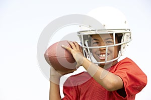 Young Boy Playing American Football