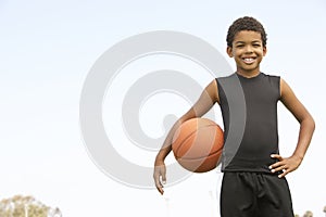 Young Boy Playing Basketball