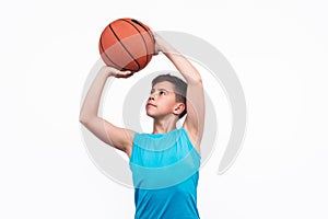 Young boy playing basketball isolated on white