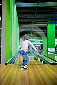 Young boy, playing bowling indoors