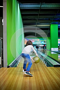 Young boy, playing bowling indoors