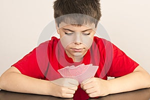 Young boy playing cards