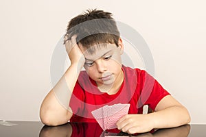 Young boy playing cards