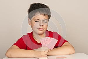 Young boy playing cards