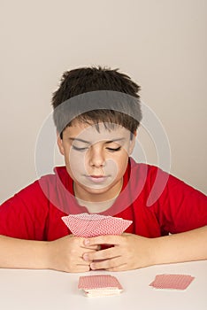 Young boy playing cards