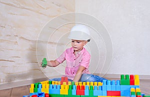 Young boy playing with colorful building blocks