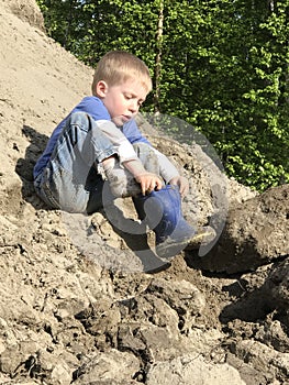 Young boy playing in the dirt