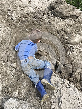 Young boy playing in the dirt