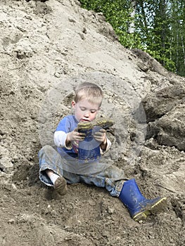 Young boy playing in the dirt