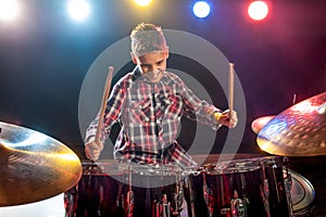 Young boy playing drums