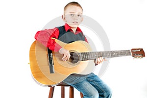 Young boy playing the guitar