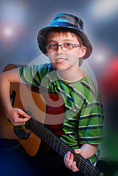 Young boy playing guitar