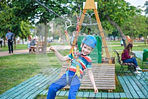 Young boy playing and having fun doing activities outdoors. Happiness and happy childhood concept