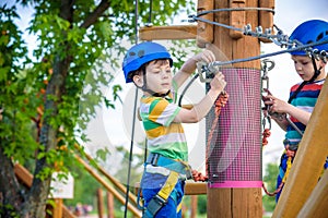 Young boy playing and having fun doing activities outdoors. Happiness and happy childhood concept