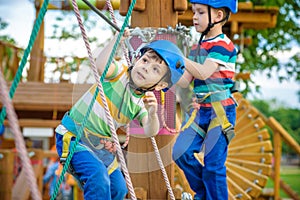 Young boy playing and having fun doing activities outdoors. Happiness and happy childhood concept