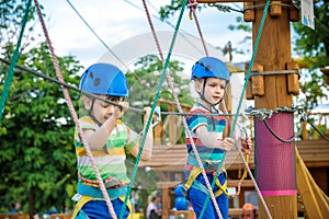 Young boy playing and having fun doing activities outdoors. Happiness and happy childhood concept