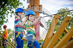 Young boy playing and having fun doing activities outdoors. Happiness and happy childhood concept