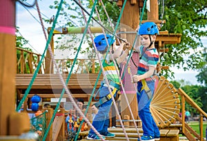 Young boy playing and having fun doing activities outdoors. Happiness and happy childhood concept