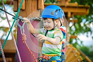 Young boy playing and having fun doing activities outdoors. Happiness and happy childhood concept