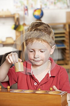 Young Boy Playing at Montessori/Pre-School