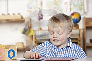 Young Boy Playing at Montessori/Pre-School