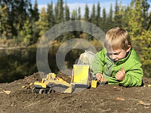 Young boy playing outside