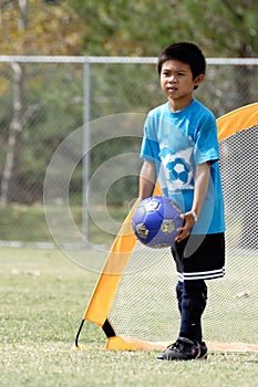 Young boy playing in soccer