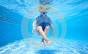 Young boy playing underwater